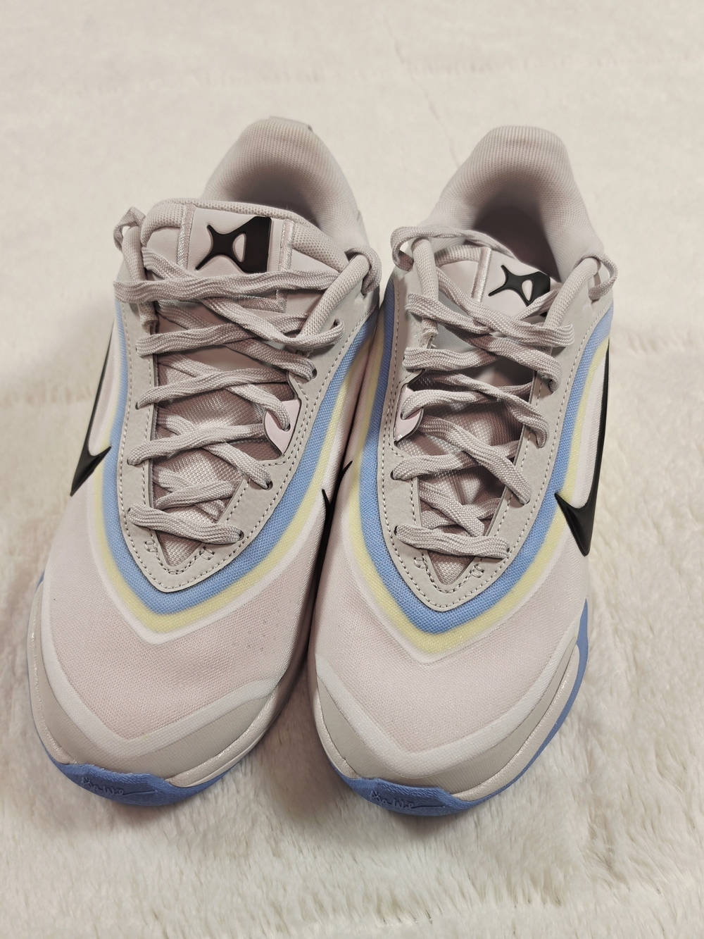 Nike Kids Pastel Pink Sneakers with Blue and Yellow Accents